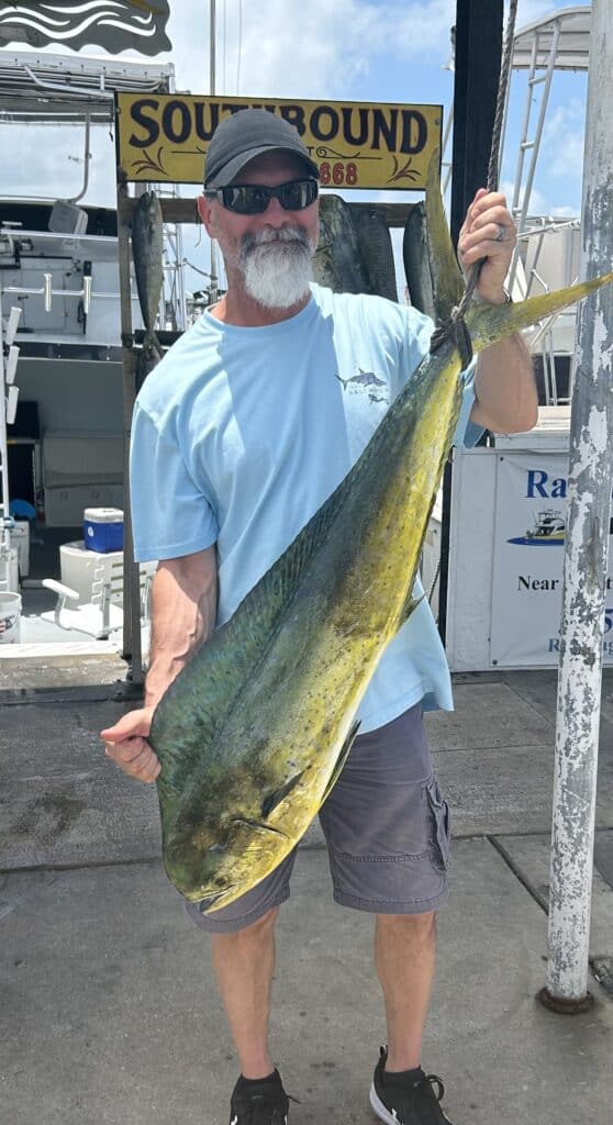 customer with 17 Cow dolphin at the dock