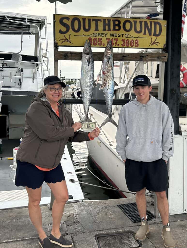 Mom and her son with 2 big Kingfish on he dock