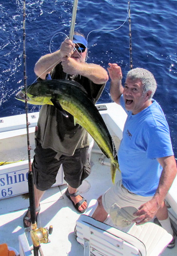 Happ about landing a big Dolphin in Key West fishing on charter boat Southbound